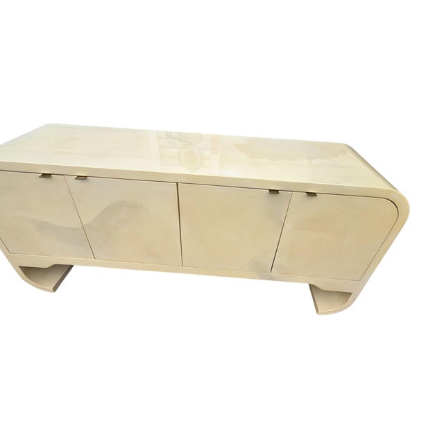 Excellent condition. minor wear. Beautiful faux goat skin lacquered credenza. Some reflection on the top surface from the...