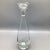 Sleek trim design in this hand blown crystal decanter with heavy bubble bottom base and flat top stopper.