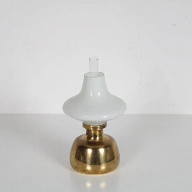 A unique, elegant oil lamp designed by Henning Koppel, manufactured by Louis Poulsen in Denmark around 1950. This...