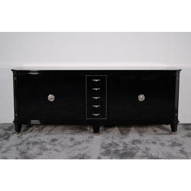 The surface was completely refinished in high-gloss black lacquer, the interior was left in its original condition, and...