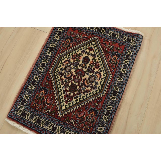 An authentic vintage traditional tribal Bidjar rug hand-knotted with fine wool and natural dyes. This finely woven...