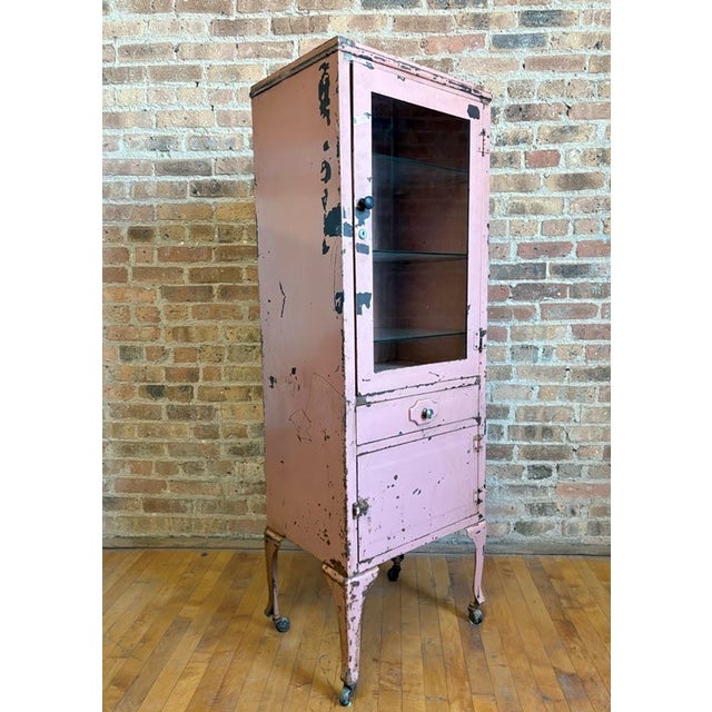 A major pop of retro personality with this one! Very fun vintage industrial metal cabinet. Originally used as a medical or...