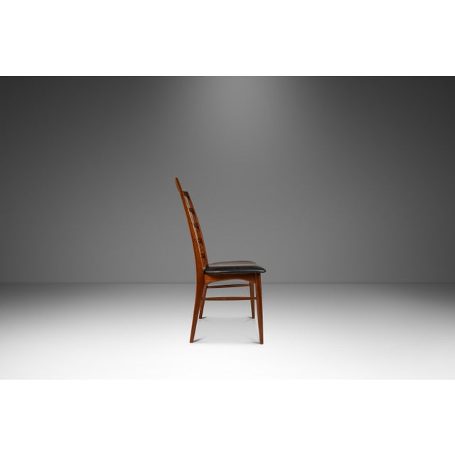 Introducing a limited set of four Danish Modern "Lis" ladderback side chairs in stunning 100% original, vintage condition....
