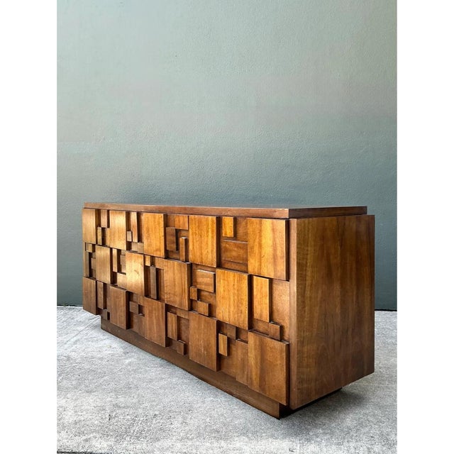 Designed and manufactured by Lane Furniture during the mid-20th century, this iconic credenza from the "Mosaics"...