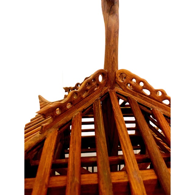 Antique Japanese pagoda shaped bird cage with a Dragon carved hook. Cage is old and has the great patina.