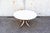 Dining table with metal and wood frame, round lacquered wood top. Model T69 Designed by Eugenio Gerli and Osvaldo Borsani...