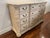 This beautiful dresser has a glazed look over and cream ivory. Beautiful carved. 12 Drawers. This item has have some aging...
