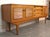 This low profile sideboard features a louvered design throughout the front. Center bank of drawers are angled out for...
