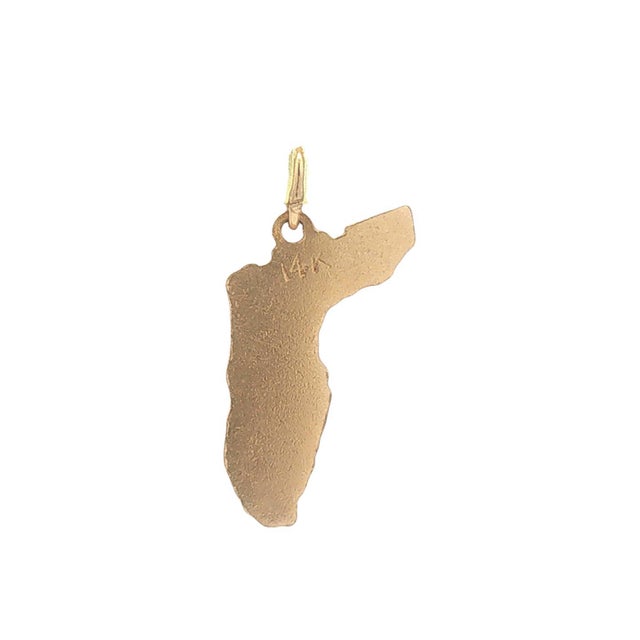 A vintage 14k gold Florida state charm. Features engraved city names: Tallahassee, Sarasota, Palm Beach, Miami. Includes a...