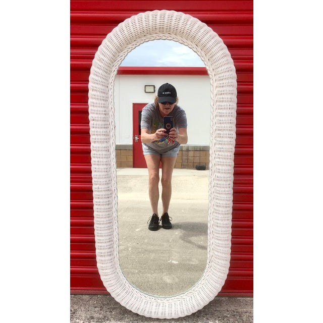 Beautiful vintage white wicker full length wall mirror. Arcged on top and bottom. Heavy well made woven wicker mirror....
