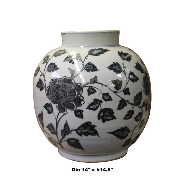 This is a handpainted Chinese off white base porcelain vase. The surface has the theme of oriental flowers graphic. The...