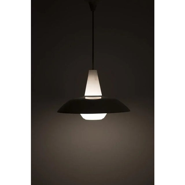 Typical 50's pendant lamp with a metal light grey shade on frosted glass. It has some traces of use but is in normal...