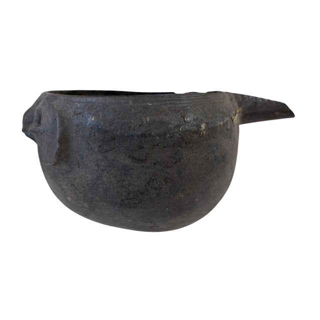 A well carved vintage ceremonial Kuba wooden cup in the form of a human head. Figural cups such as this cups are among the...