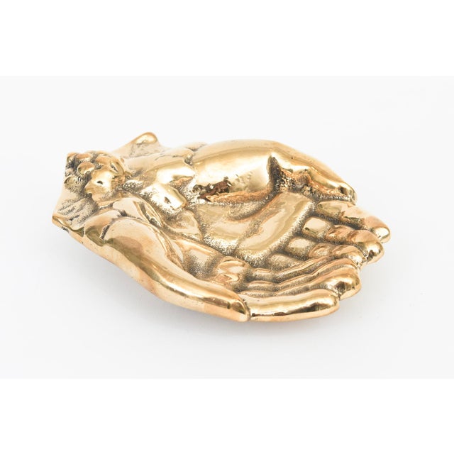 This vintage mid century modern cast bronze praying cupped hands bowl, paperweight or decorative object has now been newly...