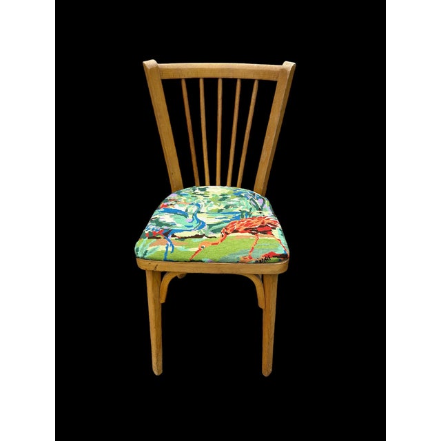 Baumann beechwood chair, 1950s The chair has been reupholstered with vintage flamingo print fabric This piece has an...