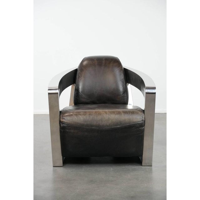 Beautiful and unique Aviator designer armchair with an aluminum frame and a stunning color scheme. : This stunning cowhide...
