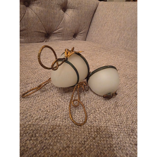 Gilt metal white Opaline Egg box that was originally fitted with a perfume bottle which is missing. The Gilt metal details...