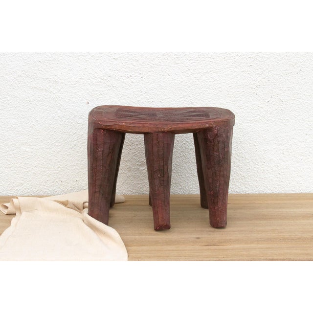 A unique piece of African art, this vintage Nupe table from Nigeria is a must-have for collectors and enthusiasts of Nupe...