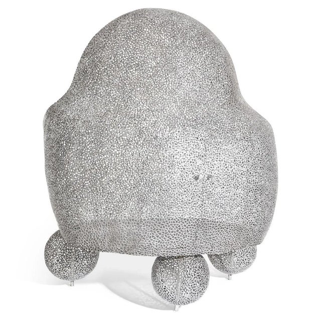 On three ball feet standing two-door design object Anacleto Spazzapan with a concave-convex body and a flat back. There is...