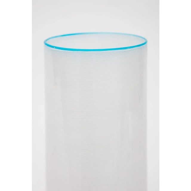 Beautiful vase blown in a filigran white spiral and light blue on the top in clear glass designed by Ercole Barovier,...