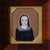 A portrait miniature of a young-faced woman identified as Elizabeth Adams, painted within a cut-corner rectangular format...