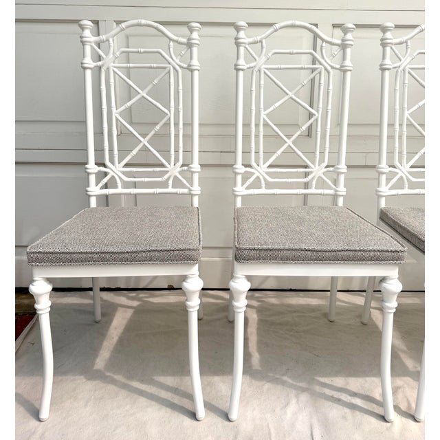 Here is a gorgeous set of four vintage faux bamboo dining chairs by Kessler, fully restored with a refined, high-end...