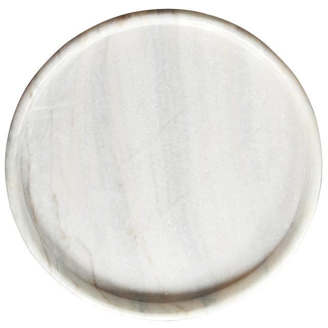 Hand-formed of marble, these contemporary accent pieces were designed with simple lines to allow the natural material...