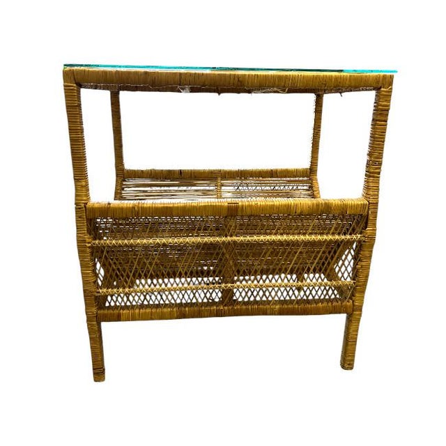 Vintage Reed Magazine Rack with Glass Top Add a touch of vintage charm to your space with this elegant reed rattan...