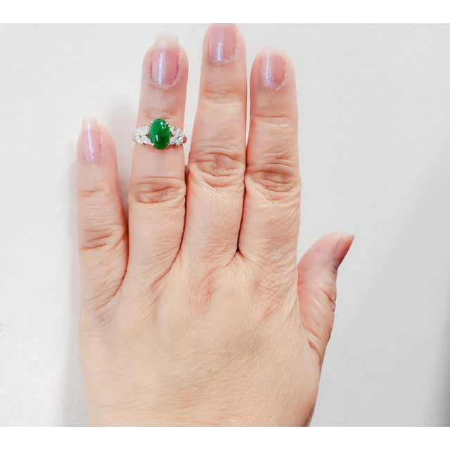 Beautiful deep green jade weighing 2.29 ct. with 0.49 ct. good quality white diamond marquise cuts. Handmade in platinum....