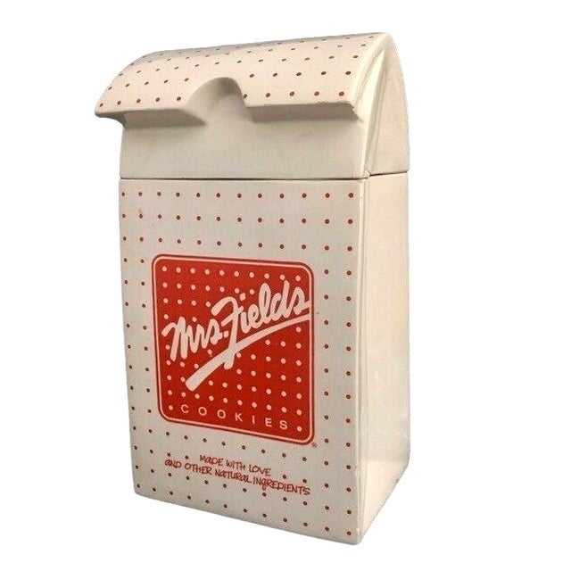 Charming vintage ceramic cookie jar by Mrs. Fields, designed to look like their iconic paper cookie bag. Features a white...