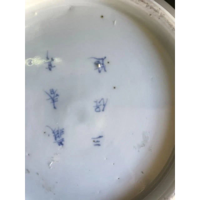 Japanese Imari (19th century) pottery covered bowl featuring decorative panels of flowers and birds on lid with...