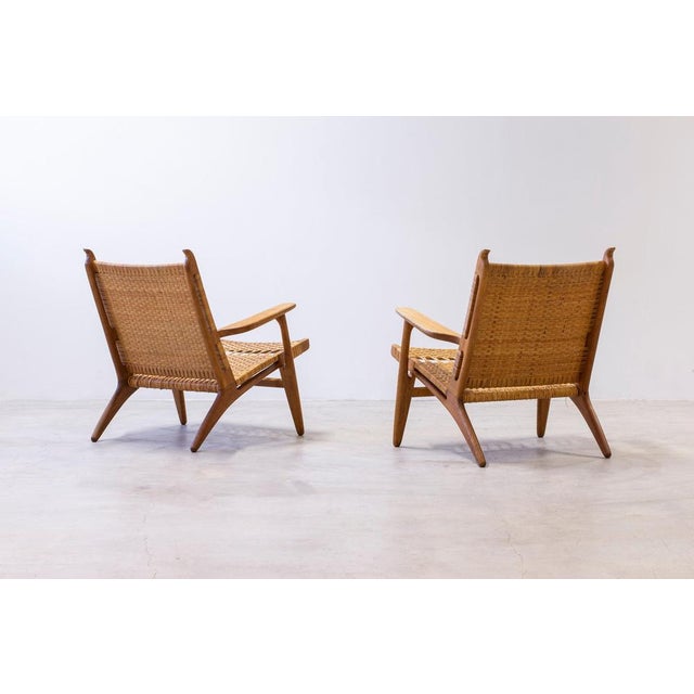 Pair of lounge chairs model ch-27 designed by hans j. Wegner. Produced in denmark by carl hansen & søn during the 1950s....