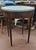 Fine antique French Boulle table. Features white marble top, brass gallery, two small drawers and two candle pull outs on...