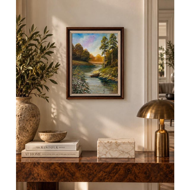 Beautiful 1995 vintage oil painting on Masonite depicting a tranquil river landscape surrounded by lush woodland. The...