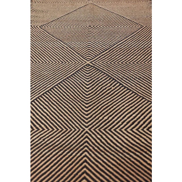 Black and Sand Tan Flatweave Zanafi Moroccan Wool Runner Rug. Hand-woven from 100% hand-spun and hand-dyed wool. A fresh...