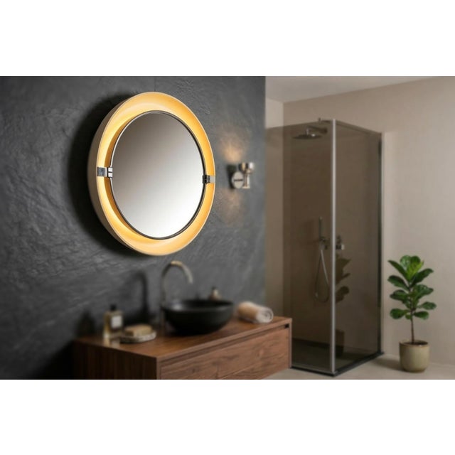 Iconic backlit wall mirror produced by the renowned company allibert in the 1970s (model a41). an authentic space age...