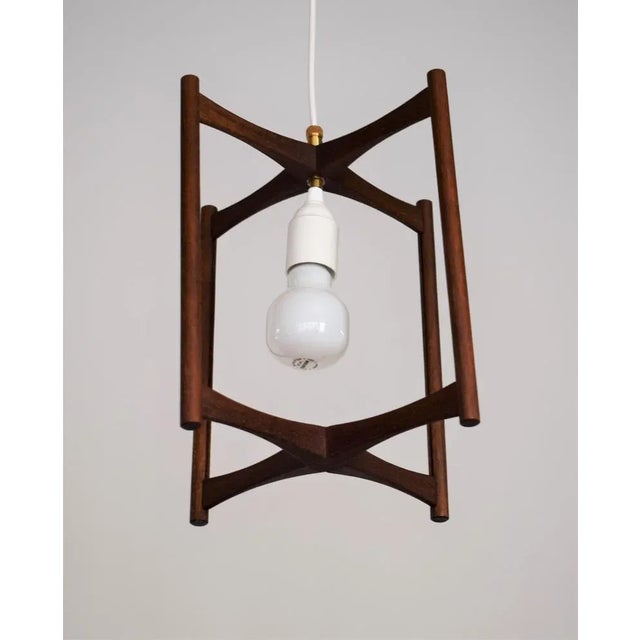 Small ceiling lamp made of teak. 1 pedestal E27 Height variable. Up to 250V (Europe/UK Standard).The wiring of this item...