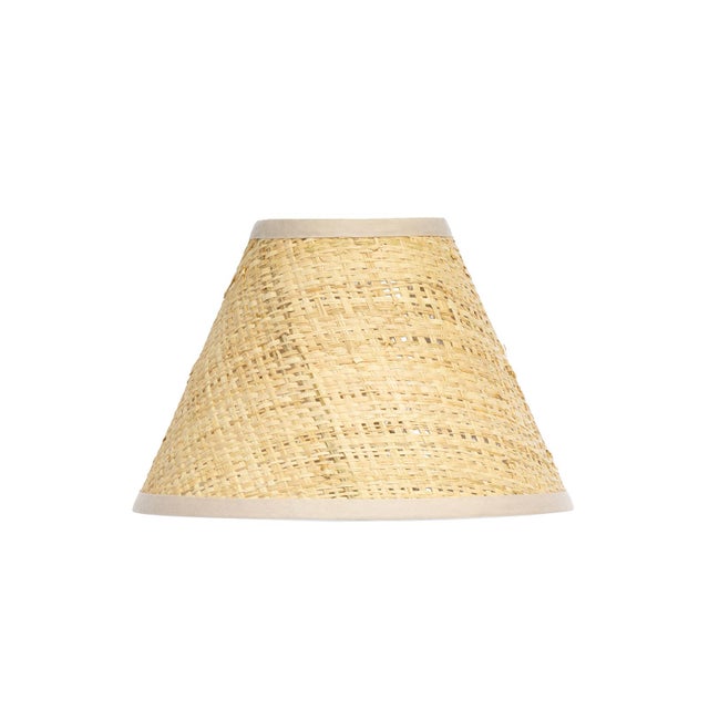 Crafted from warm Rattan, the Polly Alternate Shade features a gently tapered form that adds quiet movement and texture....