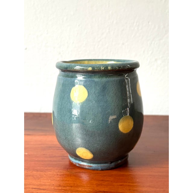 This charming unsigned ceramic cachepot beautifully captures the provincial style of traditional French pottery from the...