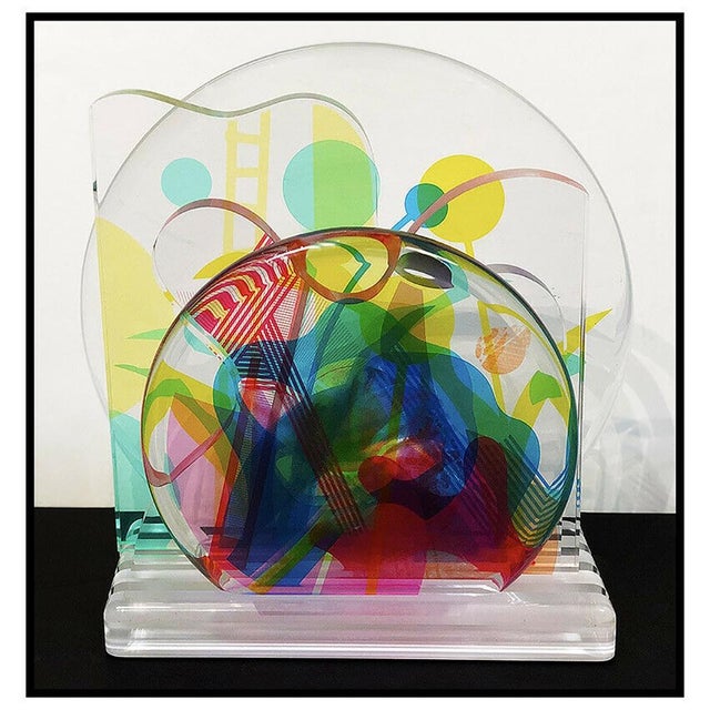 The Sculpture measures approx. 15"H x 20"W (when expanded) and is very nice in person where the vivid color that is...