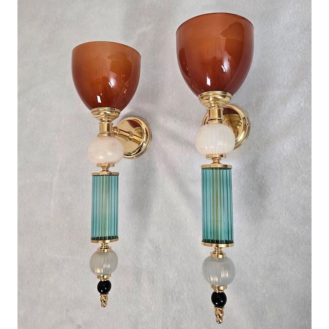 Pair of mid-century modern Murano glass wall sconces, Italy circa 1990s. The pair of Italian sconces is made of petrol...