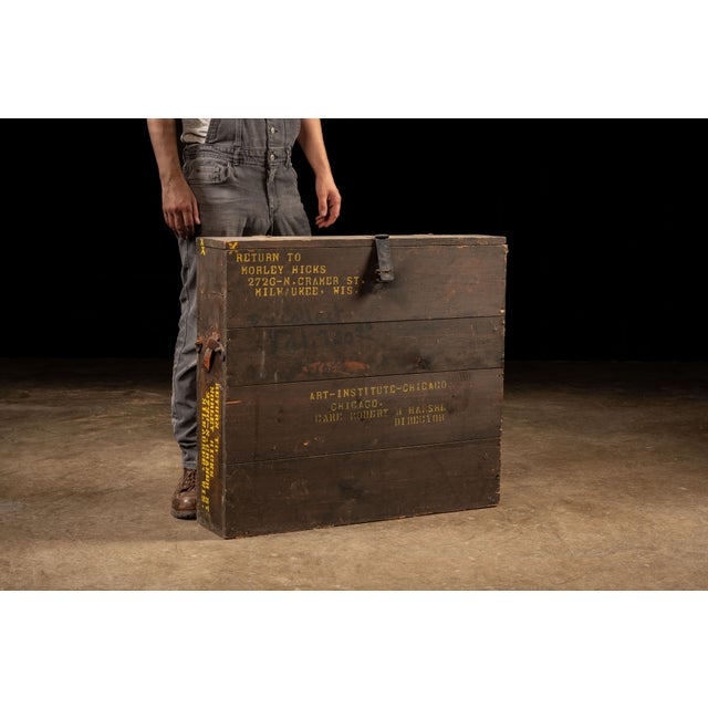 A vintage wooden shipping and transport crate dating approximately from the 1930s through the 1950s. The crate bears...