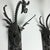 Add timeless elegance to any space with this beautiful pair of vintage wall sconces. Crafted from dark metal with...