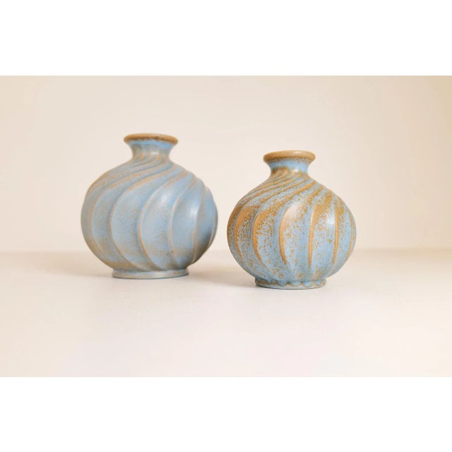 These rare and nicely sculpted vases was designed by Ewald Dahlskog and made at Bo Fajans in Sweden during the 1930-1940s....