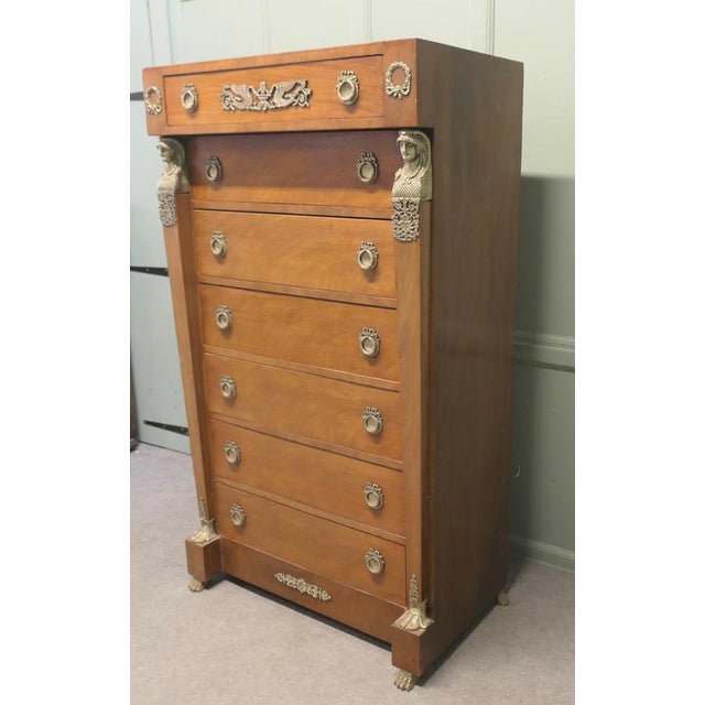 A Tall French Empire Walnut Chest of Drawers in the Neo Classical Style This is a French Satin Walnut Chest, known as a 7...