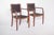 Pair of chairs with armrests, upholstered in green. Modernist in design, possibly dating from the 1940s, they have a solid...
