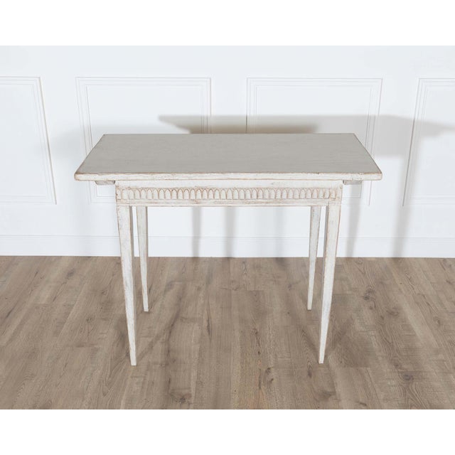 This refined 19th century Swedish Gustavian side table embodies the timeless simplicity and understated elegance...