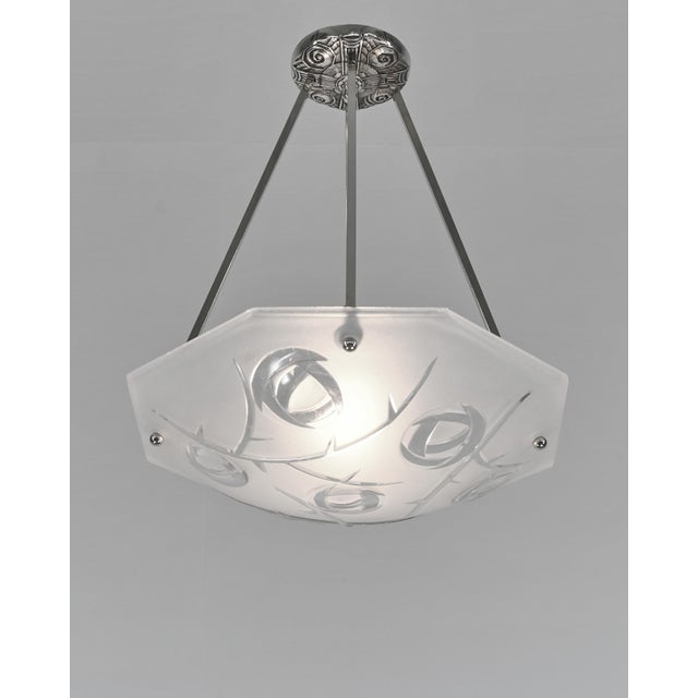 Degué A signed French art deco pendant chandelier around 1930-35 in nickel plated bronze or solid brass. The mounting...