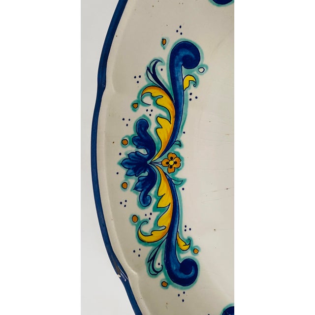 Large round Italian earthenware platter Floral decoration Good condition Dimensions: H 7 x 44 cm 20th century