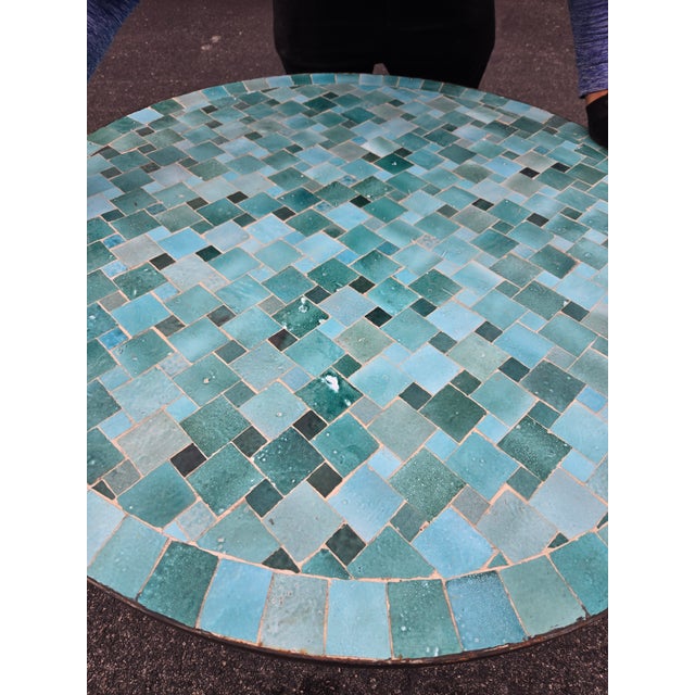 Beautiful handcrafted Moroccan mosaic table featuring an elegant emerald aqua color palette. Measuring 40 inches in...
